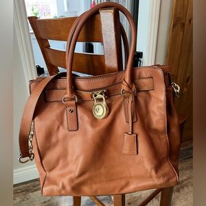 Brown Michael Kohrs leather purse